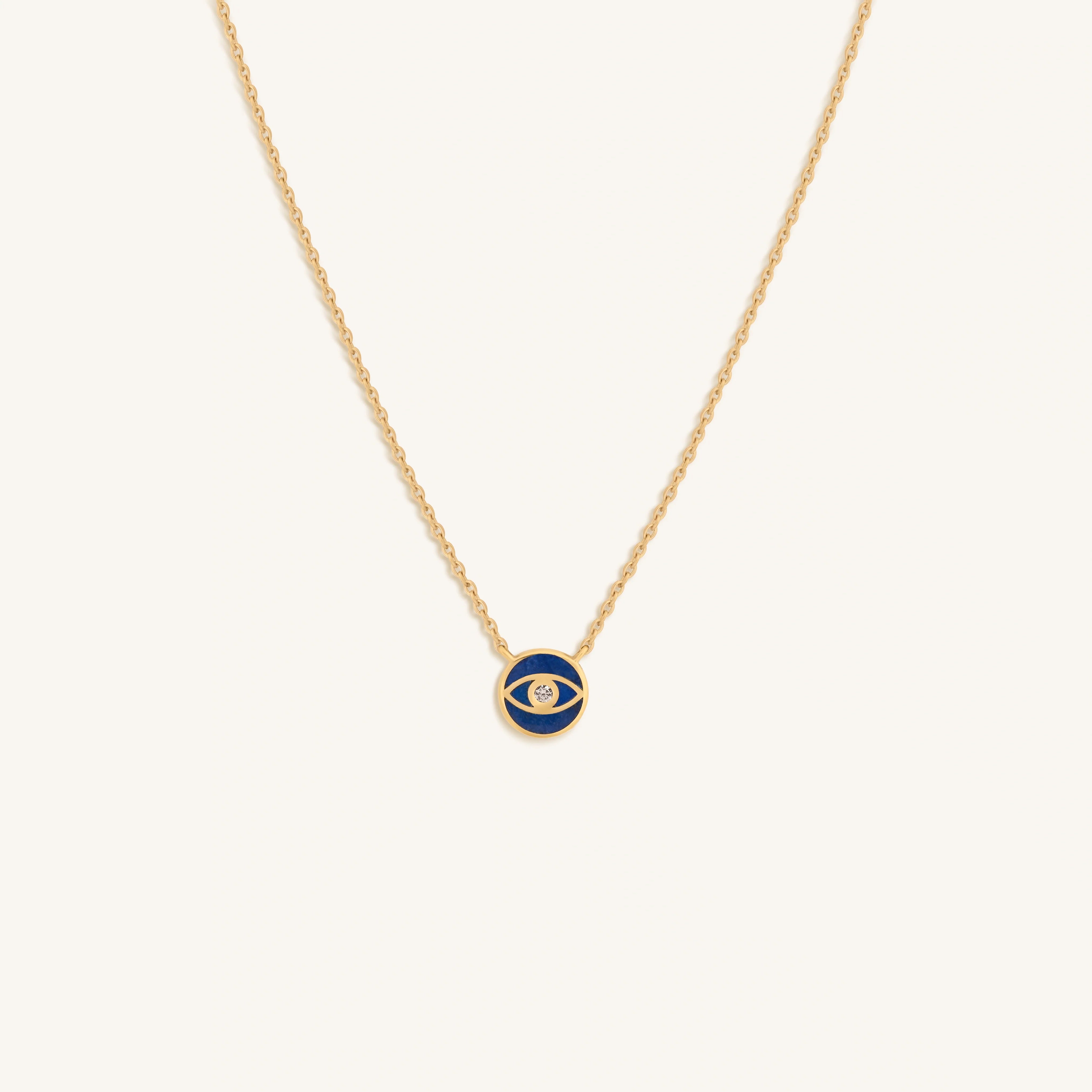 Evil Eye with against lapis lazuli circle with cubic zirconia center on gold-plated silver chain
