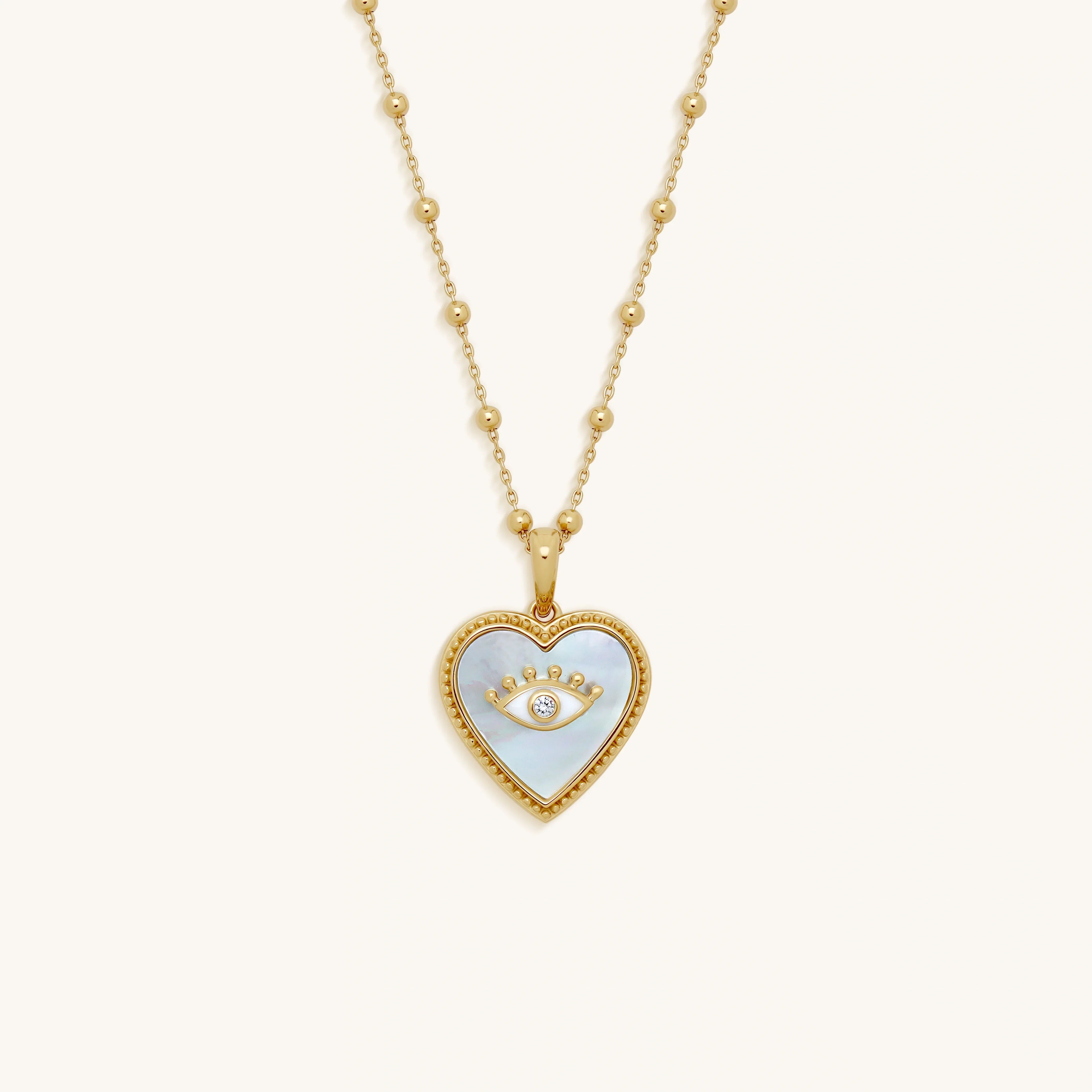 Nurturing Energy White Mother of Pearl Heart & Evil Eye Gold Necklace