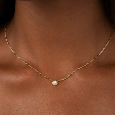 Luminous Sentinel - White Quartz April Birthstone Evil Eye Gold Necklace